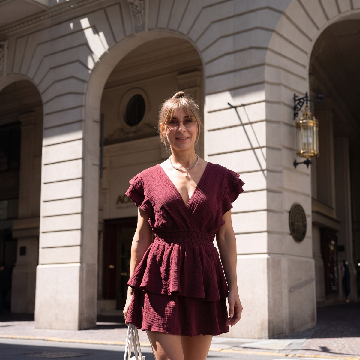 Merlot Ruffle Romper Dress - front view | deep V-neck organic cotton ruffle mini dress | Vleyn