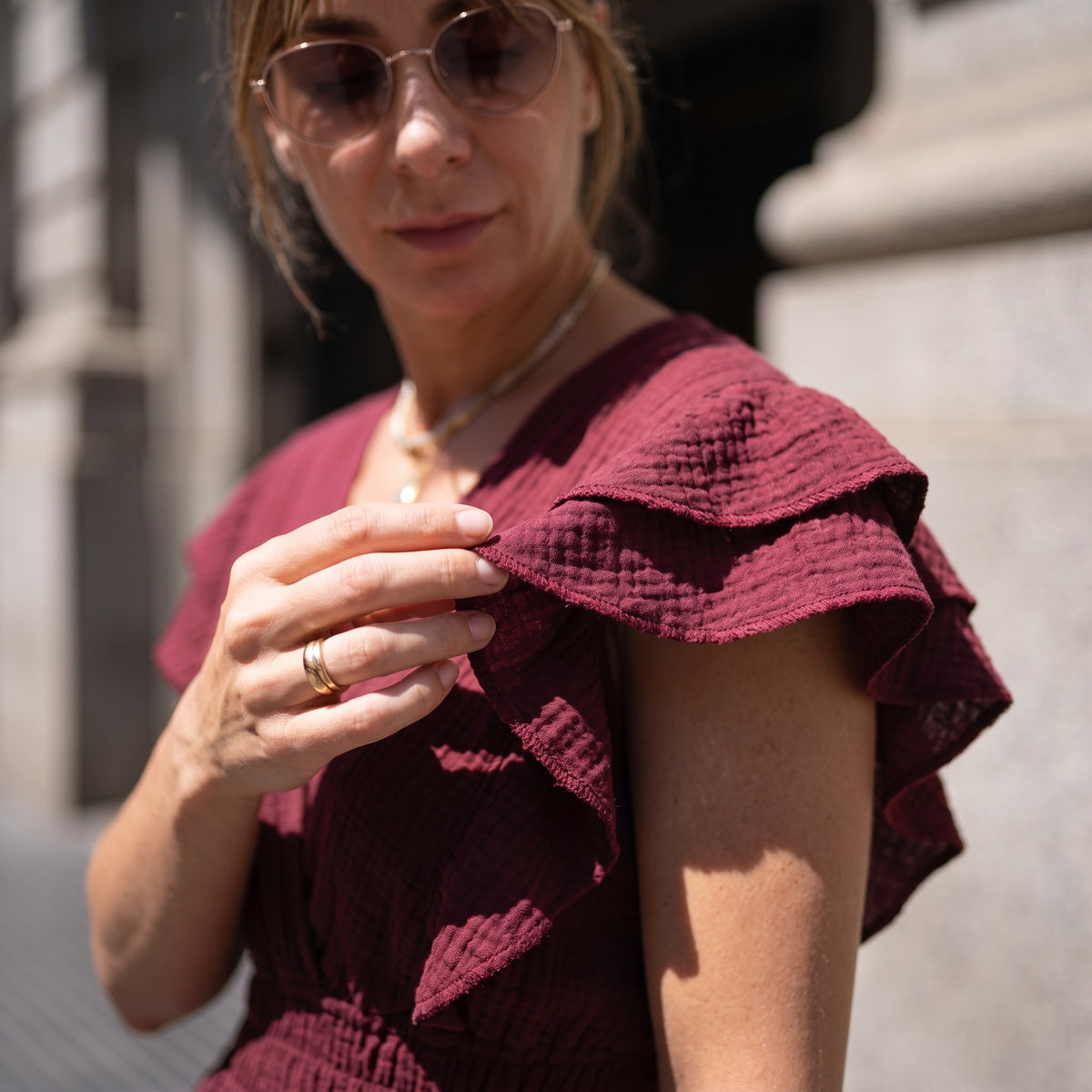 Merlot Ruffle Romper Dress - detail view | flutter ruffle sleeves organic cotton texture | Vleyn
